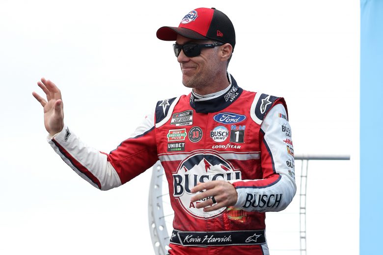 LOUDON, NEW HAMPSHIRE - JULY 18: Kevin Harvick, driver of the #4 Busch Light Apple Ford, waves to fans on stage during pre-race ceremonies prior to the NASCAR Cup Series Foxwoods Resort Casino 301 at New Hampshire Motor Speedway on July 18, 2021 in Loudon, New Hampshire. (Photo by James Gilbert/Getty Images) | Getty Images