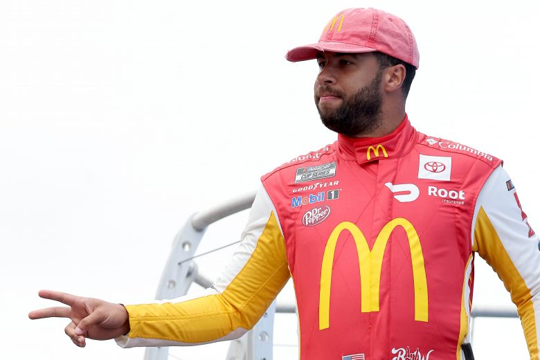 LOUDON, NEW HAMPSHIRE - JULY 18: Bubba Wallace, driver of the #23 McDonald's Toyota, waves to fans on stage during pre-race ceremonies prior to the NASCAR Cup Series Foxwoods Resort Casino 301 at New Hampshire Motor Speedway on July 18, 2021 in Loudon, New Hampshire. (Photo by James Gilbert/Getty Images) | Getty Images