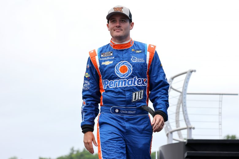 LOUDON, NEW HAMPSHIRE - JULY 18: Quin Houff, driver of the #00 Permatex Chevrolet, walks on stage during pre-race ceremonies prior to the NASCAR Cup Series Foxwoods Resort Casino 301 at New Hampshire Motor Speedway on July 18, 2021 in Loudon, New Hampshire. (Photo by James Gilbert/Getty Images) | Getty Images