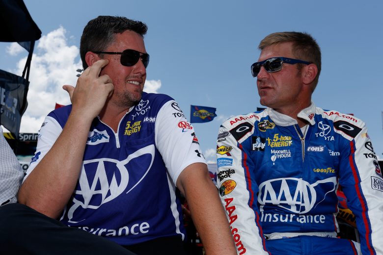 DOVER, DE - MAY 31: Clint Bowyer, driver of the #15 AAA Insurance Toyota, talks to crew chief Brian Pattie during pre-race ceremonies for the NASCAR Sprint Cup Series FedEx 400 Benefiting Autism Speaks at Dover International Speedway on May 31, 2015 in Dover, Delaware. (Photo by Todd Warshaw/Getty Images) | Getty Images