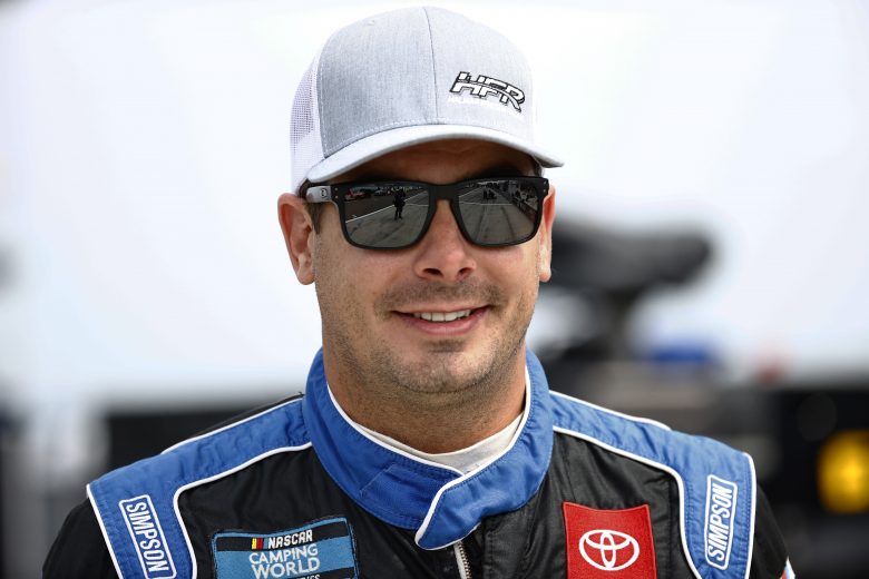 WATKINS GLEN, NEW YORK - AUGUST 07: Stewart Friesen, driver of the #52 Halmar International Toyota, walks the grid prior tothe NASCAR Camping World Truck Series United Rentals 176 at Watkins Glen International on August 07, 2021 in Watkins Glen, New York. (Photo by Jared C. Tilton/Getty Images) | Getty Images