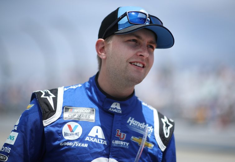 DOVER, DELAWARE - MAY 16: William Byron, driver of the #24 Axalta Chevrolet, walks on the grid during the NASCAR Cup Series Drydene 400 at Dover International Speedway on May 16, 2021 in Dover, Delaware. (Photo by Sean Gardner/Getty Images) | Getty Images