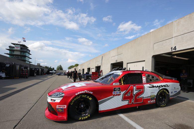 INDIANAPOLIS, INDIANA - AUGUST 13: Giorgio Romero Maggi, driver of the #42 MBM Motorsports Toyota, exits the garage area for practice for the NASCAR Xfinity Series Pennzoil 150 at the Brickyard at Indianapolis Motor Speedway on August 13, 2021 in Indianapolis, Indiana. (Photo by Stacy Revere/Getty Images) | Getty Images