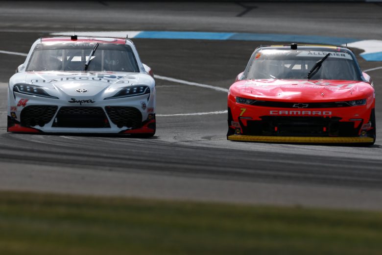 INDIANAPOLIS, INDIANA - AUGUST 14: Justin Allgaier, driver of the #7 BRANDT Chevrolet, and Ty Gibbs, driver of the #54 SportClips Haircuts Toyota, race during the NASCAR Xfinity Series Pennzoil 150 at the Brickyard at Indianapolis Motor Speedway on August 14, 2021 in Indianapolis, Indiana. (Photo by Sean Gardner/Getty Images) | Getty Images