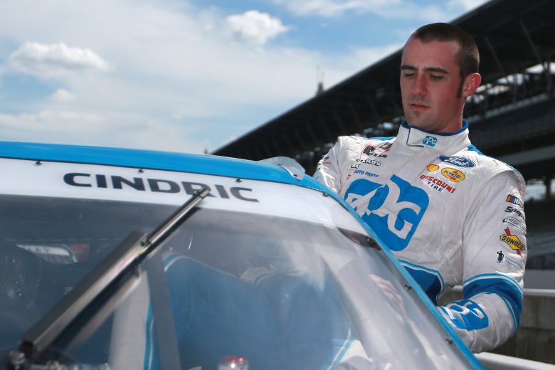 INDIANAPOLIS, INDIANA - AUGUST 14: Austin Cindric, driver of the #22 PPG Ford, enters his car to start the NASCAR Xfinity Series Pennzoil 150 at the Brickyard at Indianapolis Motor Speedway on August 14, 2021 in Indianapolis, Indiana. (Photo by Sean Gardner/Getty Images) | Getty Images