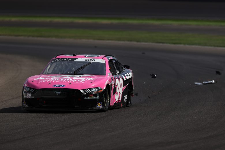INDIANAPOLIS, INDIANA - AUGUST 14: Ryan Sieg, driver of the #39 CMR Construction and Roofing/A-Game Ford, car is damaged by debris during the NASCAR Xfinity Series Pennzoil 150 at the Brickyard at Indianapolis Motor Speedway on August 14, 2021 in Indianapolis, Indiana. (Photo by Stacy Revere/Getty Images) | Getty Images