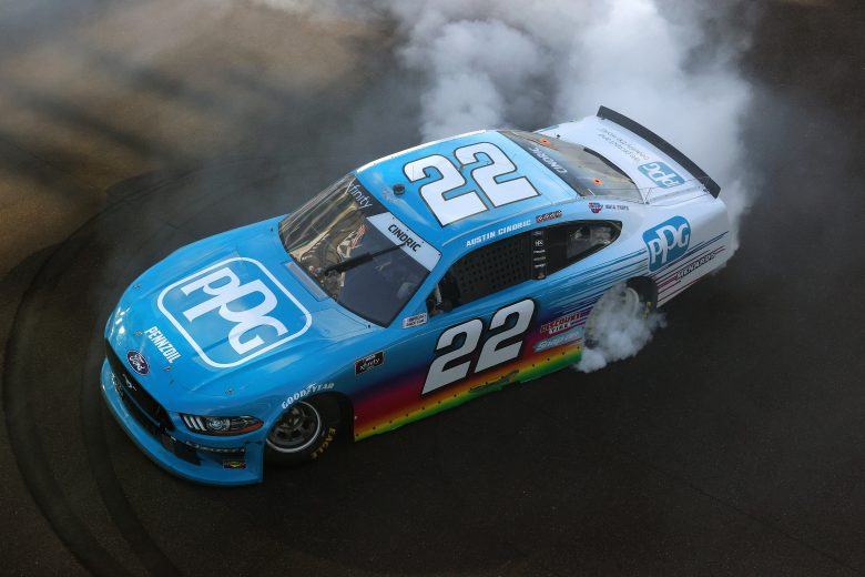 INDIANAPOLIS, INDIANA - AUGUST 14: Austin Cindric, driver of the #22 PPG Ford, celebrates with a burnout after winning the NASCAR Xfinity Series Pennzoil 150 at the Brickyard at Indianapolis Motor Speedway on August 14, 2021 in Indianapolis, Indiana. (Photo by Stacy Revere/Getty Images) | Getty Images