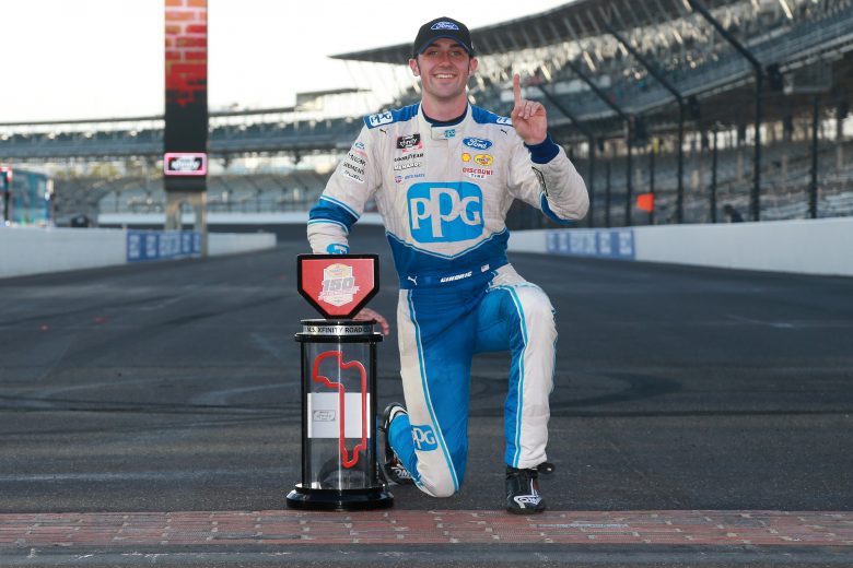 INDIANAPOLIS, INDIANA - AUGUST 14: Austin Cindric, driver of the #22 PPG Ford, celebrates on the yard of bricks after winning the NASCAR Xfinity Series Pennzoil 150 at the Brickyard at Indianapolis Motor Speedway on August 14, 2021 in Indianapolis, Indiana. (Photo by Sean Gardner/Getty Images) | Getty Images