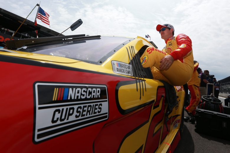 INDIANAPOLIS, INDIANA - AUGUST 15: Joey Logano, driver of the #22 Shell Pennzoil Ford, enters his car to start the NASCAR Cup Series Verizon 200 at the Brickyard at Indianapolis Motor Speedway on August 15, 2021 in Indianapolis, Indiana. (Photo by Sean Gardner/Getty Images) | Getty Images