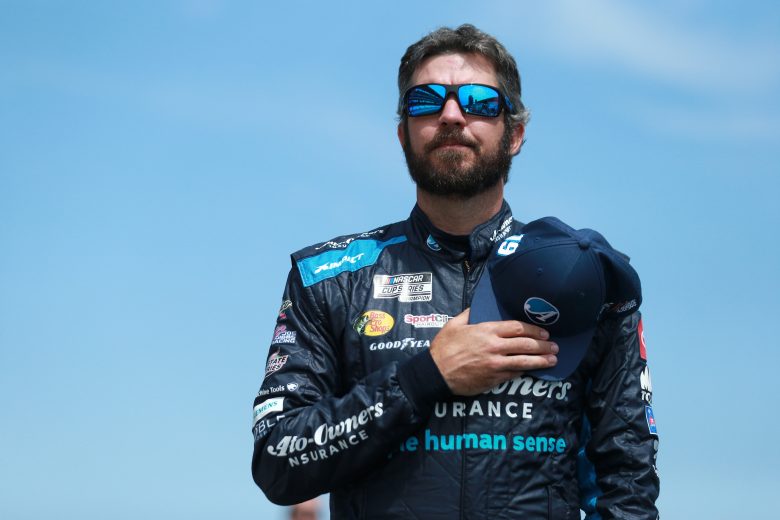 INDIANAPOLIS, INDIANA - AUGUST 15: Martin Truex Jr., driver of the #19 Auto-Owners Insurance/MTJF Toyota, stands during the national anthem prior to the NASCAR Cup Series Verizon 200 at the Brickyard at Indianapolis Motor Speedway on August 15, 2021 in Indianapolis, Indiana. (Photo by Sean Gardner/Getty Images) | Getty Images