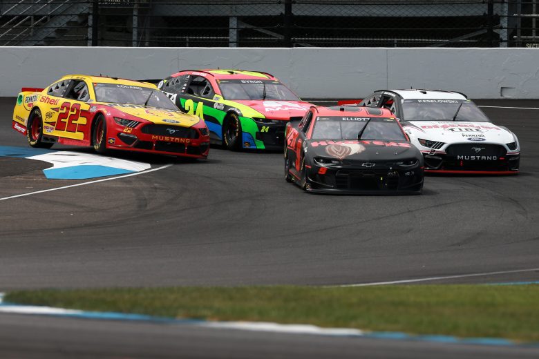 INDIANAPOLIS, INDIANA - AUGUST 15: Chase Elliott, driver of the #9 Hooters Chevrolet, Brad Keselowski, driver of the #2 Discount Tire Ford, William Byron, driver of the #24 Axalta Chevrolet, and Joey Logano, driver of the #22 Shell Pennzoil Ford, race during the NASCAR Cup Series Verizon 200 at the Brickyard at Indianapolis Motor Speedway on August 15, 2021 in Indianapolis, Indiana. (Photo by Sean Gardner/Getty Images) | Getty Images