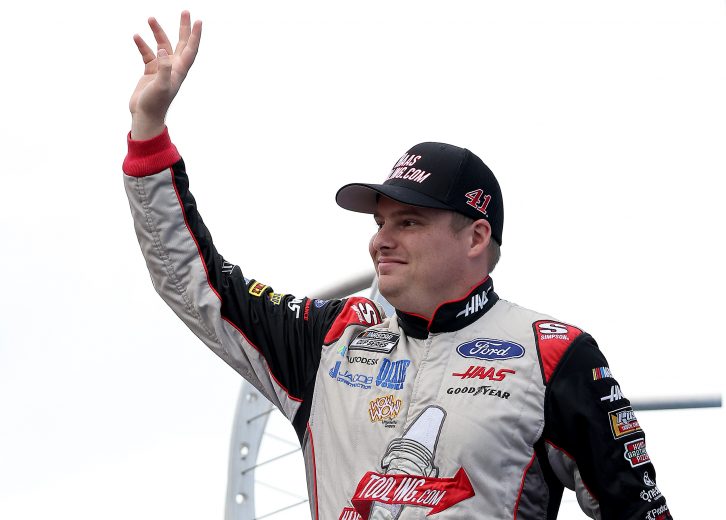 LOUDON, NEW HAMPSHIRE - JULY 18: Cole Custer, driver of the #41 HaasTooling.com Ford, waves to fans on stage during pre-race ceremonies prior to the NASCAR Cup Series  Foxwoods Resort Casino 301 at New Hampshire Motor Speedway on July 18, 2021 in Loudon, New Hampshire. (Photo by James Gilbert/Getty Images) | Getty Images