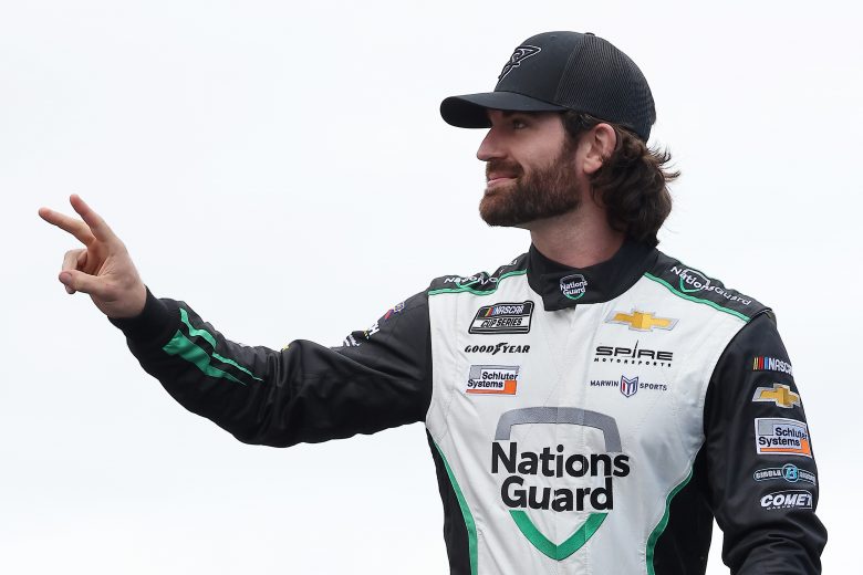 LOUDON, NEW HAMPSHIRE - JULY 18: Corey LaJoie, driver of the #7 Nations Guard Chevrolet, waves to fans on stage during pre-race ceremonies prior to the NASCAR Cup Series  Foxwoods Resort Casino 301 at New Hampshire Motor Speedway on July 18, 2021 in Loudon, New Hampshire. (Photo by James Gilbert/Getty Images) | Getty Images