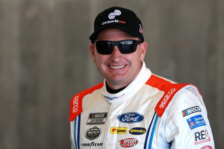 INDIANAPOLIS, INDIANA - AUGUST 14: Michael McDowell, driver of the #34 CarParts.com Ford, waits in the garage area during practice for the NASCAR Cup Series Verizon 200 at the Brickyard at Indianapolis Motor Speedway on August 14, 2021 in Indianapolis, Indiana. (Photo by Sean Gardner/Getty Images) | Getty Images