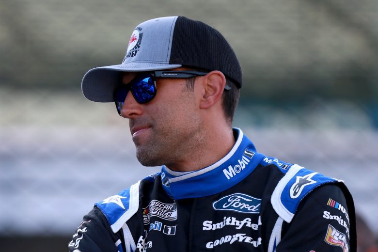 INDIANAPOLIS, INDIANA - AUGUST 15: Aric Almirola, driver of the #10 Mobil 1 Ford, waits in the garage area during qualifying for the NASCAR Cup Series Verizon 200 at the Brickyard at Indianapolis Motor Speedway on August 15, 2021 in Indianapolis, Indiana. (Photo by Sean Gardner/Getty Images) | Getty Images