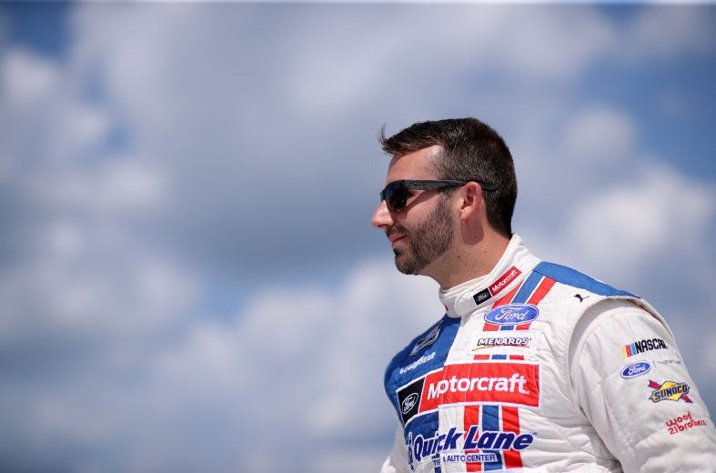 BROOKLYN, MICHIGAN - AUGUST 22: Matt DiBenedetto, driver of the #21 Master Tech/Quick Lane Ford, walks on stage during driver introductions prior to the NASCAR Cup Series FireKeepers Casino 400 at Michigan International Speedway on August 22, 2021 in Brooklyn, Michigan. (Photo by Sean Gardner/Getty Images) | Getty Images