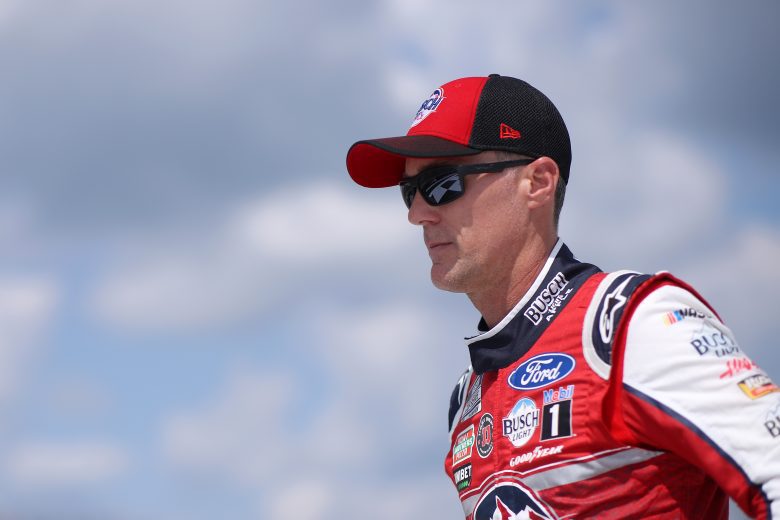 BROOKLYN, MICHIGAN - AUGUST 22: Kevin Harvick, driver of the #4 Busch Light Apple Ford, walks on stage during driver introductions prior to the NASCAR Cup Series FireKeepers Casino 400 at Michigan International Speedway on August 22, 2021 in Brooklyn, Michigan. (Photo by Sean Gardner/Getty Images) | Getty Images