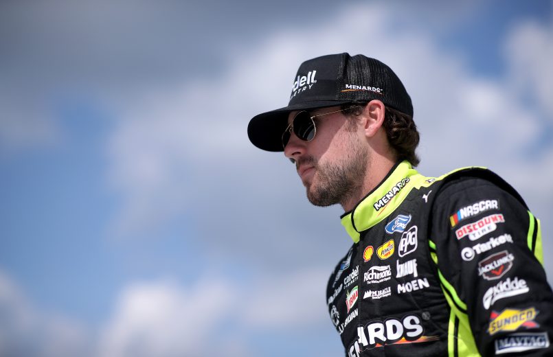 BROOKLYN, MICHIGAN - AUGUST 22: Ryan Blaney, driver of the #12 Menards/Cardell Cabinetry Ford, walks on stage during driver introductions prior to the NASCAR Cup Series FireKeepers Casino 400 at Michigan International Speedway on August 22, 2021 in Brooklyn, Michigan. (Photo by Sean Gardner/Getty Images) | Getty Images