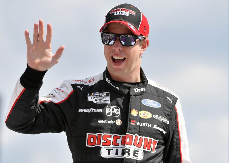 BROOKLYN, MICHIGAN - AUGUST 22: Brad Keselowski, driver of the #2 Discount Tire Ford, walks on stage during driver introductions prior to the NASCAR Cup Series FireKeepers Casino 400 at Michigan International Speedway on August 22, 2021 in Brooklyn, Michigan. (Photo by Logan Riely/Getty Images) | Getty Images