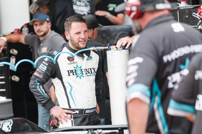 Justin Bonsignore, driver of the #51 Phoenix Communications Inc. Chevrolet, looks on during Rumble at the Ridge 200 for the NASCAR Whelen Modified Tour at Beech Ridge Motor Speedway in Scarborough, Maine on August 21, 2021. (Tristan Spinski/NASCAR)