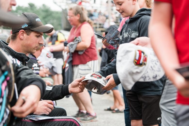 Drivers sign autographs at the Rumble at the Ridge 200 for the NASCAR Whelen Modified Tour at Beech Ridge Motor Speedway in Scarborough, Maine on August 21, 2021. (Tristan Spinski/NASCAR)