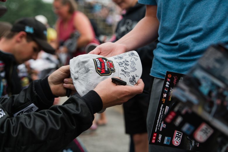 Drivers sign autographs at the Rumble at the Ridge 200 for the NASCAR Whelen Modified Tour at Beech Ridge Motor Speedway in Scarborough, Maine on August 21, 2021. (Tristan Spinski/NASCAR)