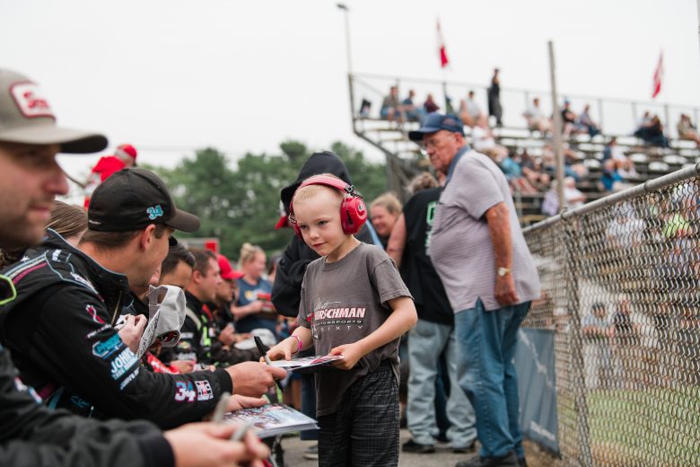 Drivers sign autographs at the Rumble at the Ridge 200 for the NASCAR Whelen Modified Tour at Beech Ridge Motor Speedway in Scarborough, Maine on August 21, 2021. (Tristan Spinski/NASCAR)