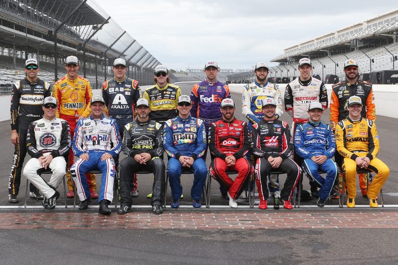 INDIANAPOLIS, IN - SEPTEMBER 10: Kyle Busch, driver of the #18 M&M's Caramel Toyota, Aric Almirola, driver of the #10 Smithfield Ford, Ryan Blaney, driver of the #12 BODYARMOR Ford, Brad Keselowski, driver of the #2 Discount Tire Ford, Joey Logano, driver of the #22 Shell Pennzoil Ford, Alex Bowman, driver of the #88 Axalta Chevrolet, Chase Elliott, driver of the #9 NAPA Auto Parts Chevrolet, Denny Hamlin, driver of the #11 FedEx Possibilities Toyota, Martin Truex Jr., driver of the #78 Auto-Owners Insurance Toyota, Austin Dillon, driver of the #3 Dow MOLYKOTE Chevrolet, Kevin Harvick, driver of the #4 Jimmy John's New 9-Grain Wheat Sub Ford, Clint Bowyer, driver of the #14 Mobil 1/Rush Truck Centers Ford, Jimmie Johnson, driver of the #48 Lowe's for Pros Chevrolet, Kurt Busch, driver of the #41 Haas Automation/Monster Energy Ford, Kyle Larson, driver of the #42 Credit One Bank Chevrolet, Erik Jones, driver of the #20 buyatoyota.com Toyota, pose for a photo after making the NASCAR Playoffs following the Monster Energy NASCAR Cup Series Big Machine Vodka 400 at the Brickyard at Indianapolis Motor Speedway on September 10, 2018 in Indianapolis, Indiana. (Photo by Brian Lawdermilk/Getty Images) | Getty Images