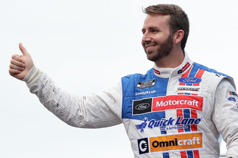 LOUDON, NEW HAMPSHIRE - JULY 18: Matt DiBenedetto, driver of the #21 Motorcraft/Quick Lane Ford, gives a thumbs up to fans on stage during pre-race ceremonies prior to the NASCAR Cup Series Foxwoods Resort Casino 301 at New Hampshire Motor Speedway on July 18, 2021 in Loudon, New Hampshire. (Photo by James Gilbert/Getty Images) | Getty Images