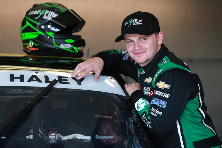INDIANAPOLIS, INDIANA - AUGUST 13: Justin Haley, driver of the #11 LeafFilter Gutter Protection Chevrolet,waits in the garage area during practice for the NASCAR Xfinity Series Pennzoil 150 at the Brickyard at Indianapolis Motor Speedway on August 13, 2021 in Indianapolis, Indiana. (Photo by Sean Gardner/Getty Images) | Getty Images