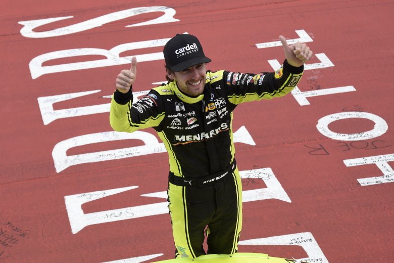 BROOKLYN, MICHIGAN - AUGUST 22: Ryan Blaney, driver of the #12 Menards/Cardell Cabinetry Ford, celebrates after winning the NASCAR Cup Series FireKeepers Casino 400 at Michigan International Speedway on August 22, 2021 in Brooklyn, Michigan. (Photo by Logan Riely/Getty Images) | Getty Images