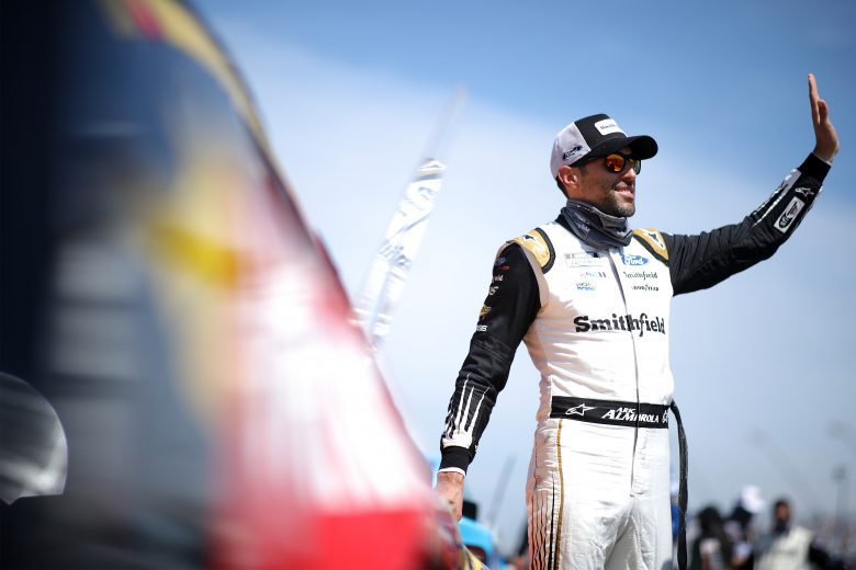 DARLINGTON, SOUTH CAROLINA - MAY 09: Aric Almirola, driver of the #10 Smithfield/Winn-Dixie Ford, waves to fans on the grid prior to the NASCAR Cup Series Goodyear 400 at Darlington Raceway on May 09, 2021 in Darlington, South Carolina. (Photo by Sean Gardner/Getty Images) | Getty Images