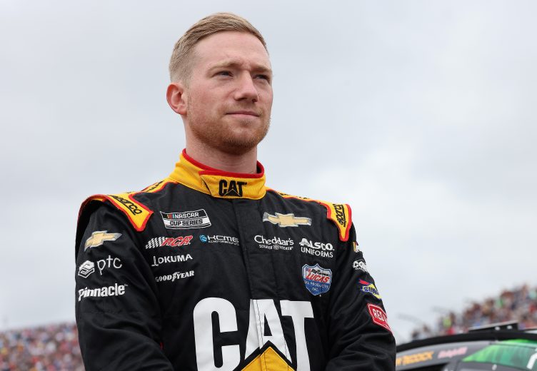 LOUDON, NEW HAMPSHIRE - JULY 18: Tyler Reddick, driver of the #8 Cat #WeDigLandscaping Chevrolet, stands on the grid during pre-race ceremonies prior to the NASCAR Cup Series  Foxwoods Resort Casino 301 at New Hampshire Motor Speedway on July 18, 2021 in Loudon, New Hampshire. (Photo by James Gilbert/Getty Images) | Getty Images