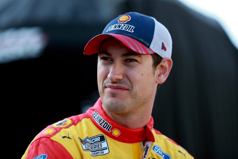 INDIANAPOLIS, INDIANA - AUGUST 15: Joey Logano, driver of the #22 Shell Pennzoil Ford, waits in the garage area during qualifying for the NASCAR Cup Series Verizon 200 at the Brickyard at Indianapolis Motor Speedway on August 15, 2021 in Indianapolis, Indiana. (Photo by Sean Gardner/Getty Images) | Getty Images