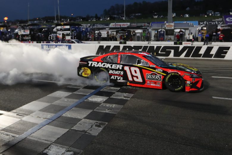 MARTINSVILLE, VIRGINIA - APRIL 11: Martin Truex Jr., driver of the #19 Bass Pro Toyota, celebrates with a burnout after winning the NASCAR Cup Series Blue-Emu Maximum Pain Relief 500 at Martinsville Speedway on April 11, 2021 in Martinsville, Virginia. (Photo by James Gilbert/Getty Images) | Getty Images