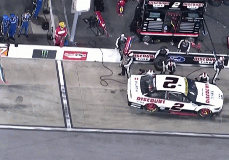 2 Pit Crew Member Push Car Out Of Stall