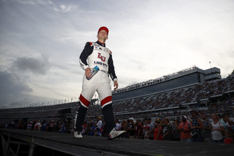 DAYTONA BEACH, FLORIDA - AUGUST 28: William Byron, driver of the #24 Liberty University Chevrolet, walks the stage during pre-race ceremonies prior to the NASCAR Cup Series Coke Zero Sugar 400 at Daytona International Speedway on August 28, 2021 in Daytona Beach, Florida. (Photo by Jared C. Tilton/Getty Images) | Getty Images