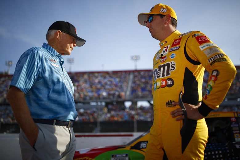 DARLINGTON, SOUTH CAROLINA - SEPTEMBER 05: Kyle Busch, driver of the #18 M&M's Toyota, and team owner and Hall of Famer Joe Gibbs talk on the grid prior to the NASCAR Cup Series Cook Out Southern 500 at Darlington Raceway on September 05, 2021 in Darlington, South Carolina. (Photo by Jared C. Tilton/Getty Images) | Getty Images