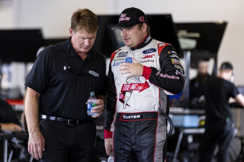DAYTONA BEACH, FLORIDA - SEPTEMBER 07: Cole Custer, driver of the #41 NASCAR Next Gen car speaks with a team member in the garage during the NASCAR Cup Series test at Daytona International Speedway on September 07, 2021 in Daytona Beach, Florida. (Photo by James Gilbert/Getty Images) | Getty Images