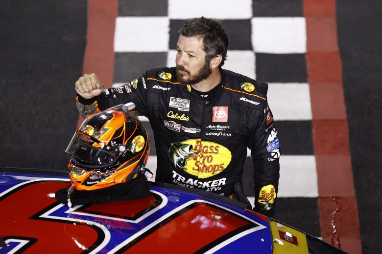 RICHMOND, VIRGINIA - SEPTEMBER 11: Martin Truex Jr., driver of the #19 Bass Pro Shops Red White Blue Toyota, celebrates after winning the NASCAR Cup Series Federated Auto Parts 400 Salute to First Responders at Richmond Raceway on September 11, 2021 in Richmond, Virginia. (Photo by Jared C. Tilton/Getty Images) | Getty Images