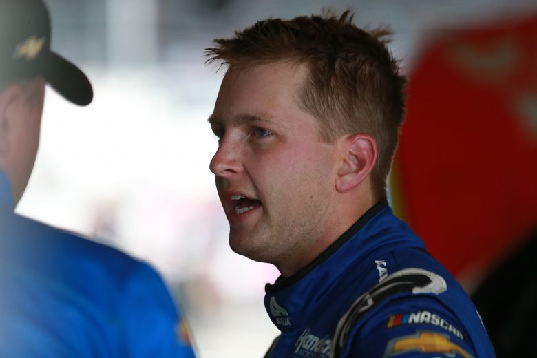 INDIANAPOLIS, INDIANA - AUGUST 14: William Byron, driver of the #24 Axalta Chevrolet, talks with crew in the garage area during practice for the NASCAR Cup Series Verizon 200 at the Brickyard at Indianapolis Motor Speedway on August 14, 2021 in Indianapolis, Indiana. (Photo by Sean Gardner/Getty Images) | Getty Images