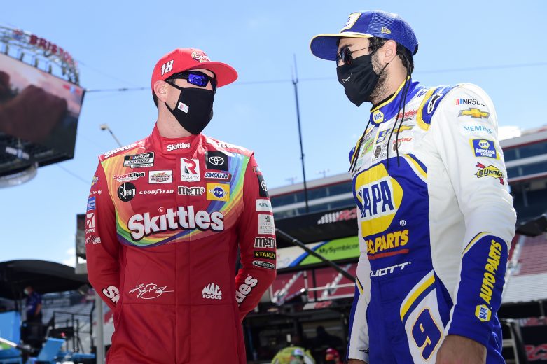 BRISTOL, TENNESSEE - MAY 31: Kyle Busch, driver of the #18 Skittles Toyota, talks with Chase Elliott, driver of the #9 NAPA Auto Parts Chevrolet, during the NASCAR Cup Series Food City presents the Supermarket Heroes 500 at Bristol Motor Speedway on May 31, 2020 in Bristol, Tennessee. (Photo by Jared C. Tilton/Getty Images) | Getty Images