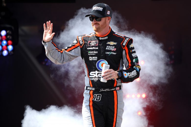 RICHMOND, VIRGINIA - SEPTEMBER 11: Jeb Burton, driver of the #10 State Water Heaters Chevrolet, waves to fans on stage during pre-race ceremonies prior to the NASCAR Xfinity Series Go Bowling 250 at Richmond Raceway on September 11, 2021 in Richmond, Virginia. (Photo by Sean Gardner/Getty Images) | Getty Images