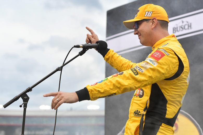 BRISTOL, TENNESSEE - SEPTEMBER 18: Kyle Busch, driver of the #18 M&M's Toyota, speaks to fans on stage during pre-race ceremonies prior to the NASCAR Cup Series Bass Pro Shops Night Race at Bristol Motor Speedway on September 18, 2021 in Bristol, Tennessee. (Photo by Logan Riely/Getty Images) | Getty Images