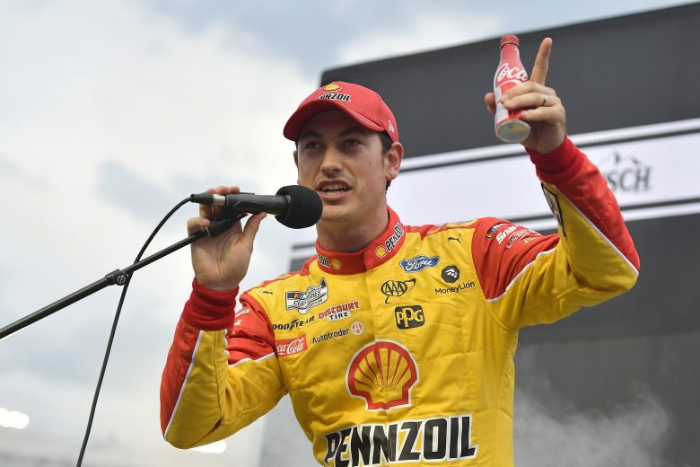 BRISTOL, TENNESSEE - SEPTEMBER 18: Joey Logano, driver of the #22 Shell Pennzoil Ford, speaks to fans on stage during pre-race ceremonies prior to the NASCAR Cup Series Bass Pro Shops Night Race at Bristol Motor Speedway on September 18, 2021 in Bristol, Tennessee. (Photo by Logan Riely/Getty Images) | Getty Images