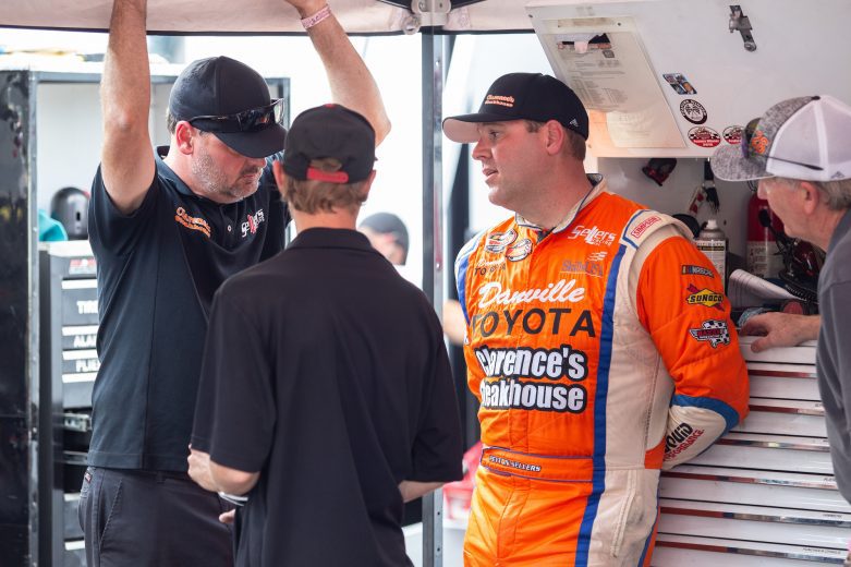 Peyton Sellers, driver of the #26 ClarenceÕs Steakhouse and Danville Toyota, talks with crew during the NASCAR Advanced Auto Parts Weekly Series at Dominion Raceway on September 18, 2021 in Woodford, Virginia. (Parker Michels-Boyce/NASCAR)