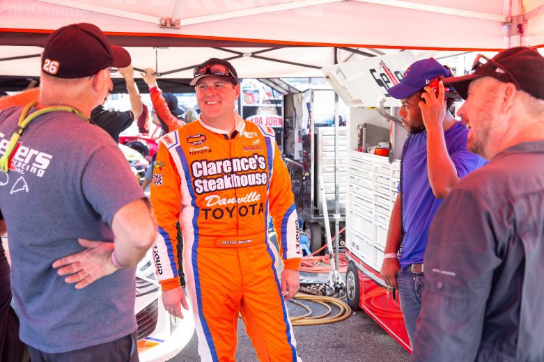 Peyton Sellers, driver of the #26 ClarenceÕs Steakhouse and Danville Toyota, talks with crew members during the NASCAR Advanced Auto Parts Weekly Series at Dominion Raceway on September 18, 2021 in Woodford, Virginia. (Parker Michels-Boyce/NASCAR)