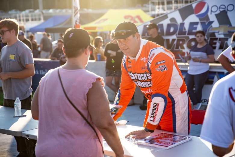 Peyton Sellers, driver of the #26 ClarenceÕs Steakhouse and Danville Toyota, interacts with fans during the NASCAR Advanced Auto Parts Weekly Series at Dominion Raceway on September 18, 2021 in Woodford, Virginia. (Parker Michels-Boyce/NASCAR)