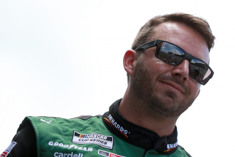 HAMPTON, GEORGIA - JULY 11: Matt DiBenedetto, driver of the #21 Menards/Quaker State Ford, walks the stage during pre-race ceremonies prior to the NASCAR Cup Series Quaker State 400 presented by Walmart at Atlanta Motor Speedway on July 11, 2021 in Hampton, Georgia. (Photo by Sean Gardner/Getty Images) | Getty Images