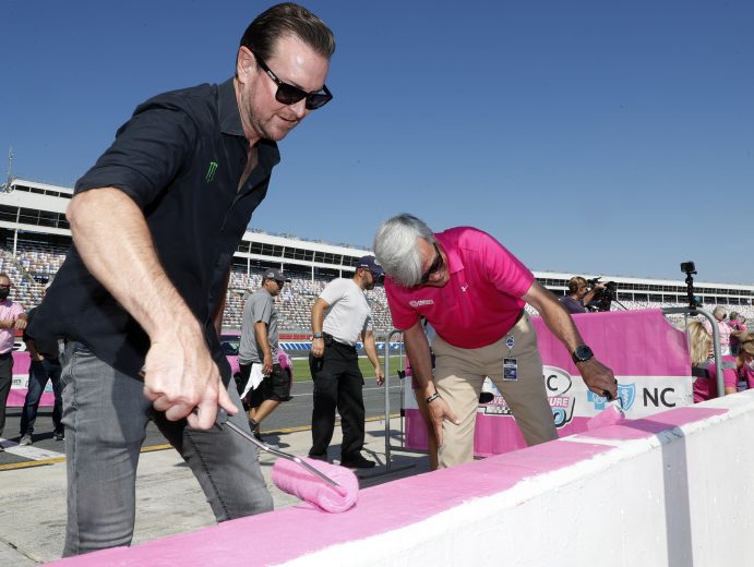 September 28 , 2021: Kurt Busch, Daniel Hemric and Beast Cancer survivors paint the walls pink at the Charlotte Motor Speedway in Charlotte  , NC.  ,  .  .   .  (HHP/Andrew Coppley)